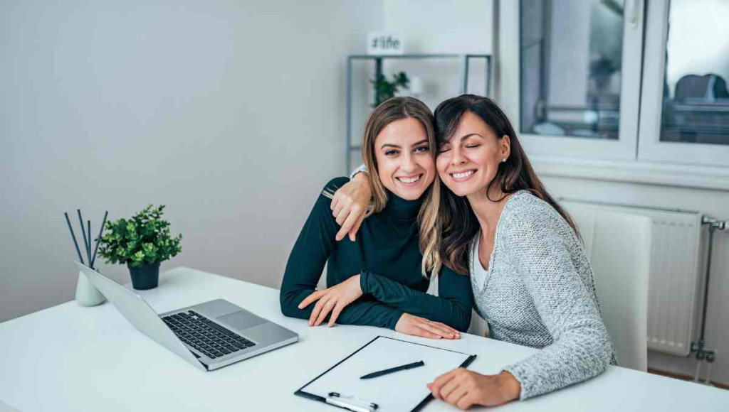 2 Women, one a bookkeeper and one an accountant, working on small business bookkeeping