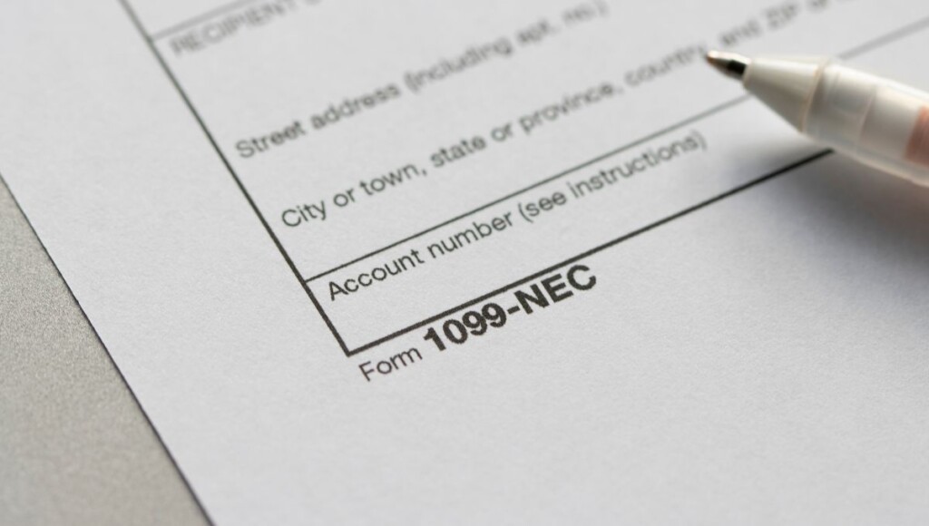 Close-up of a blank Form 1099-NEC with a pen resting on it, illustrating the 1099-NEC threshold change for 2026